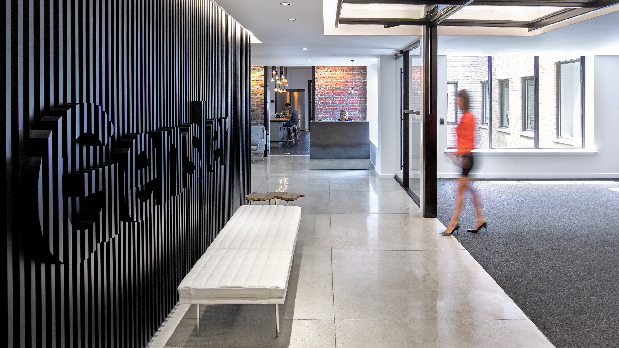 A person walking in a hallway.