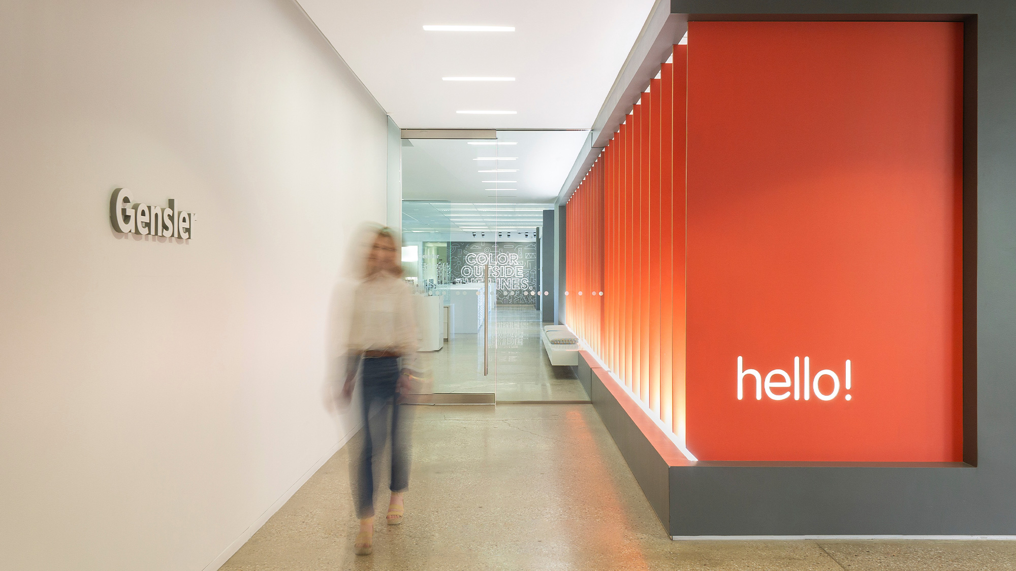 A person walking in a hallway.