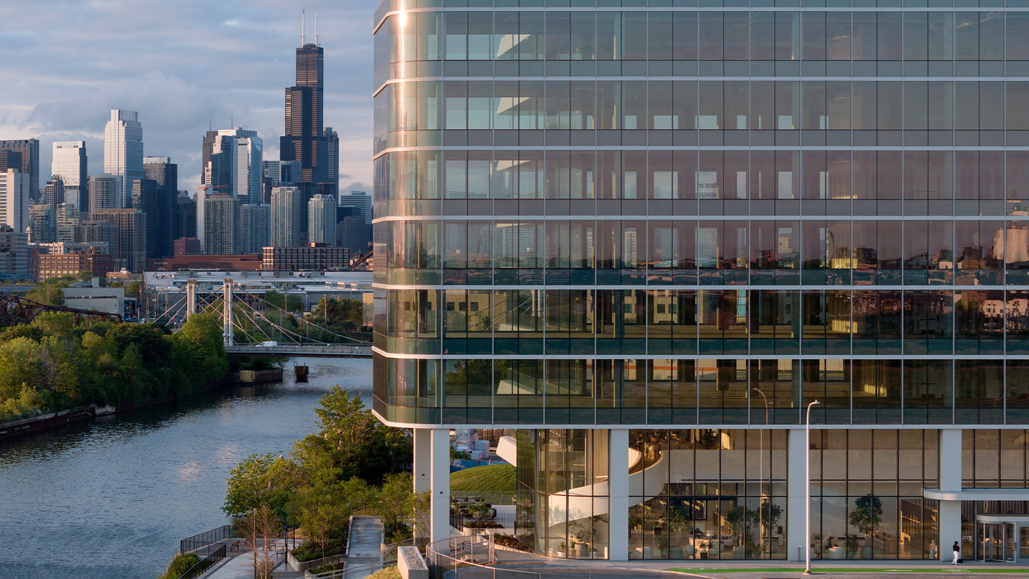 A building with a body of water in the front.