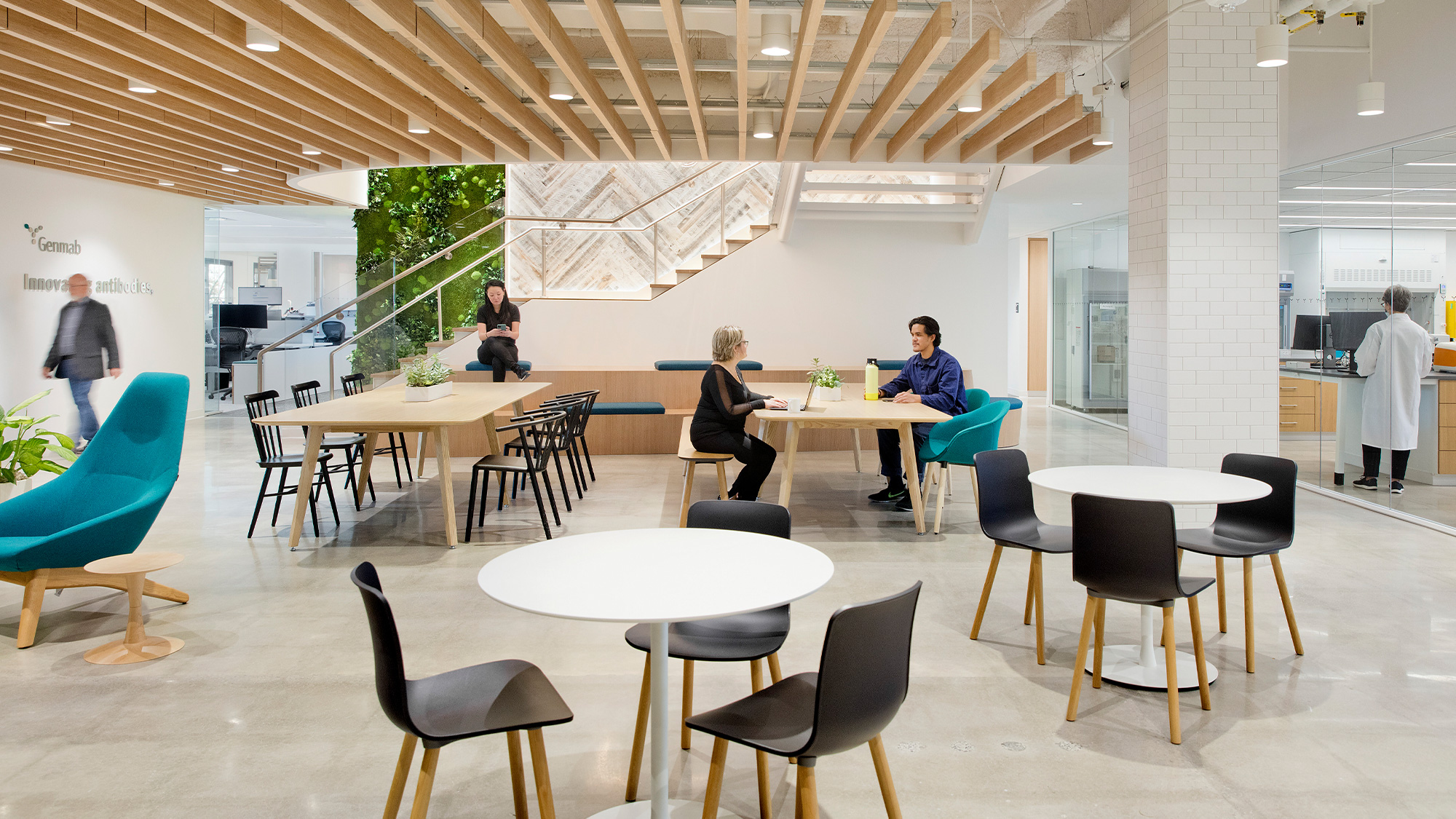 A group of people sitting at tables.