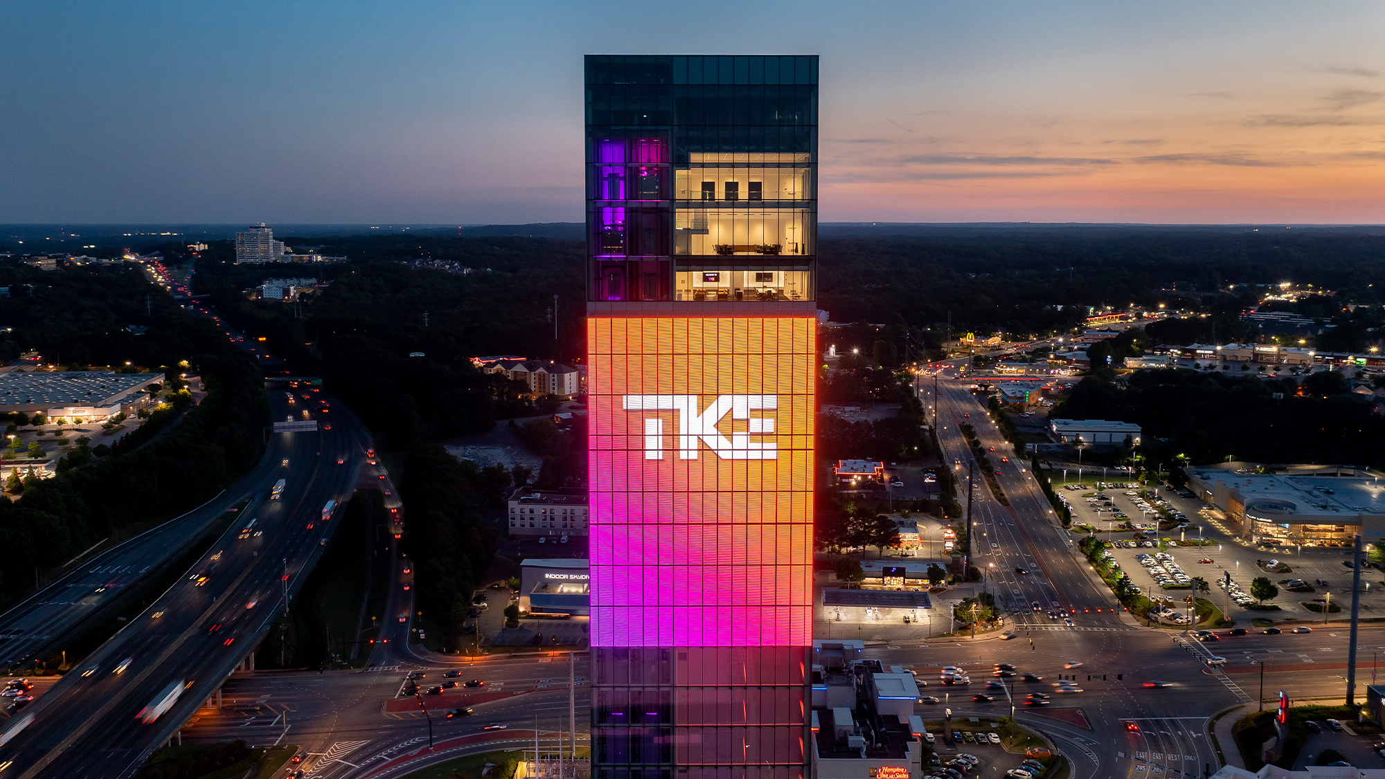 A tall building with lights at night.