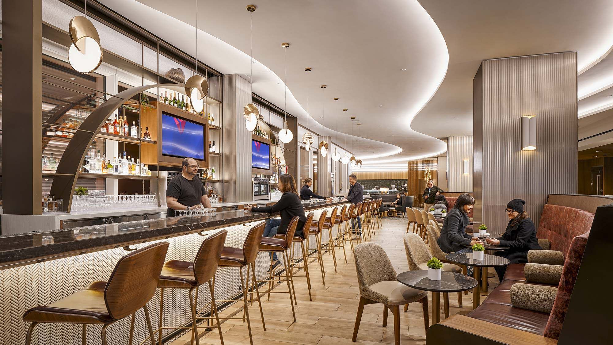 A group of people sitting at tables.