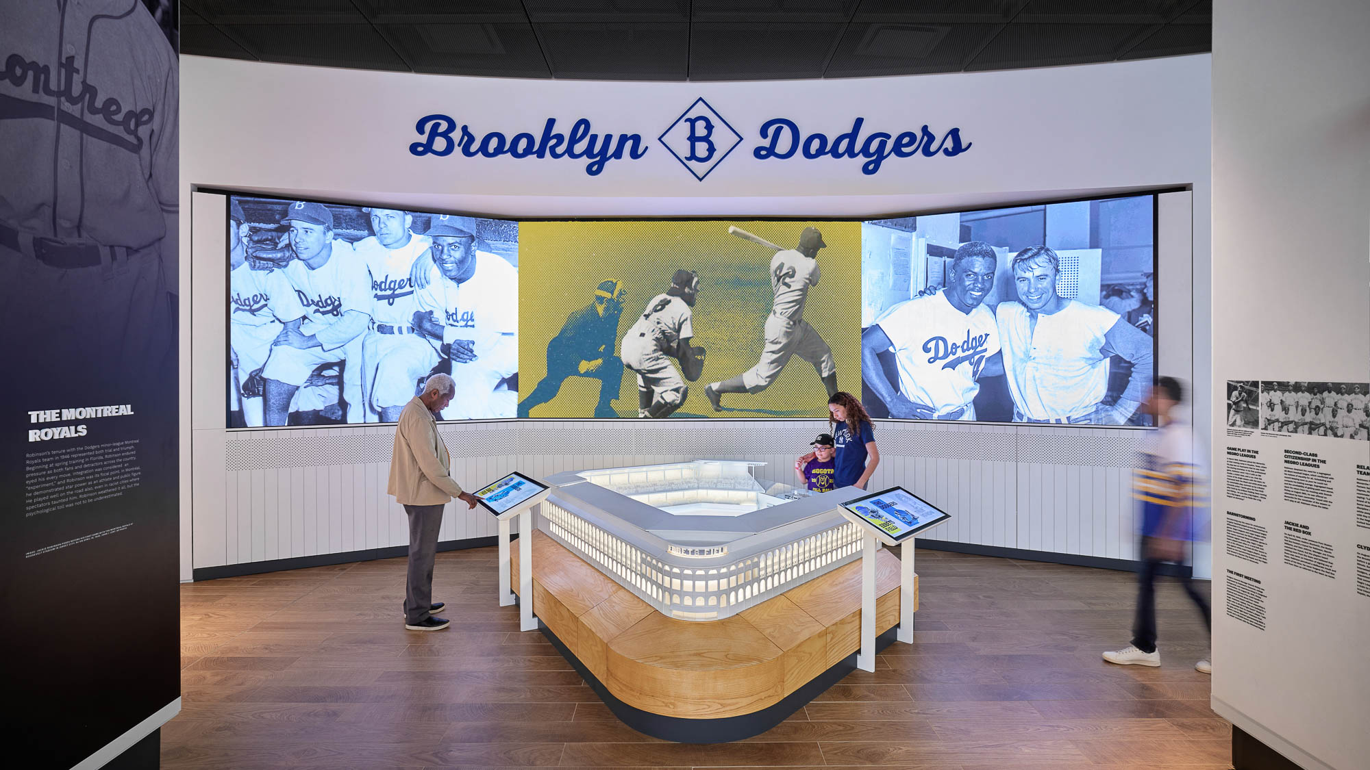 A person standing next to a display.