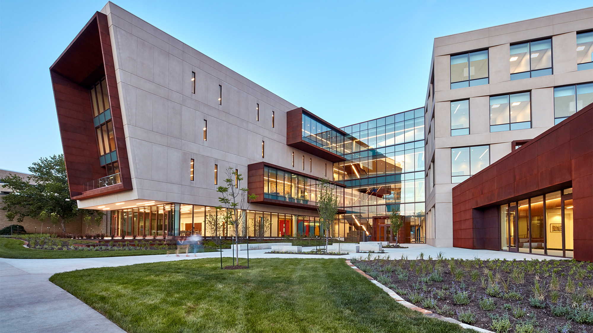 A building with a lawn in front.